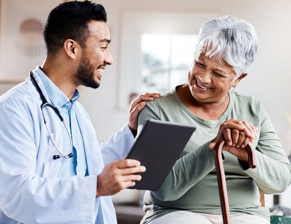 Doctor talking to elderly patient