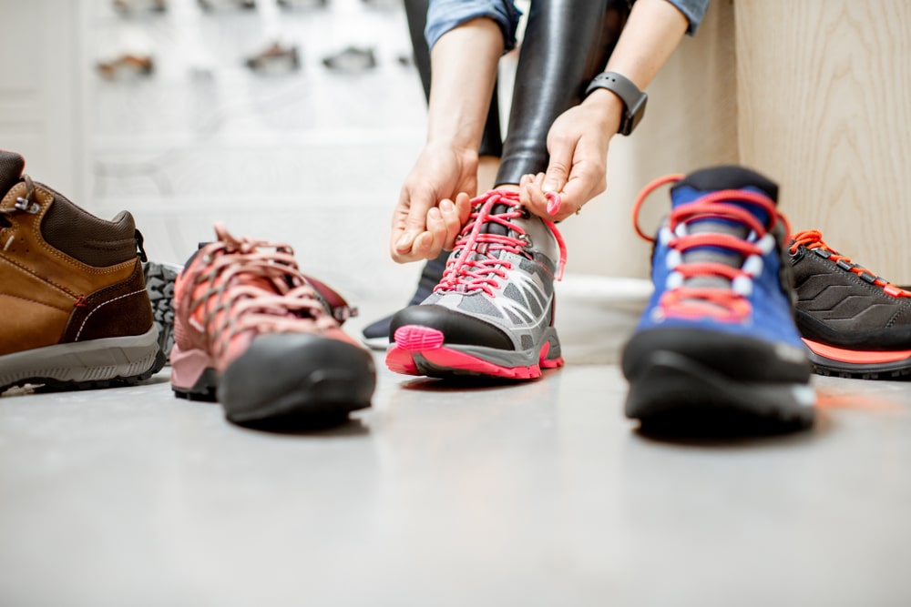 person putting shoes on on the floor